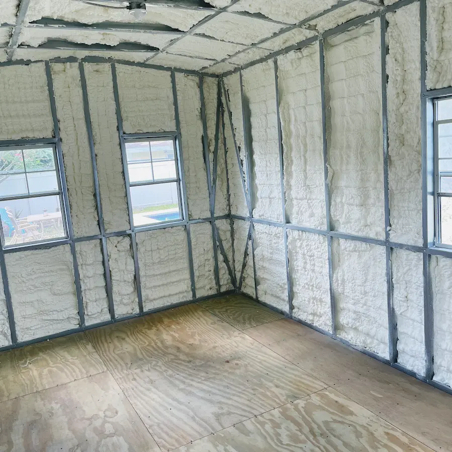 Closed-cell spray foam insulation applied to wall cavities in a residential project in New Berlin